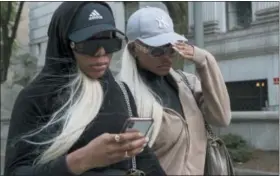  ?? MARY ALTAFFER — THE ASSOCIATED PRESS ?? Shannade Clermont, right, and her twin sister Shannon leave Federal court in New York after her arraignmen­t, Wednesday, July 11, 2018.