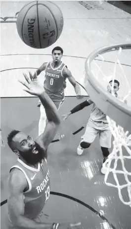  ?? (AP) ?? HOUSTON Rockets’ James Harden (13) shoots against the Memphis Grizzlies during the first half of an NBA basketball game in Houston.