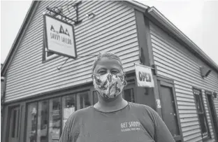  ?? TIM KROCHAK/SALTWIRE NETWORK ?? Katherine Eisenhauer, owner of The Savvy Sailor, stands in front of her cafe in Lunenburg on Monday.