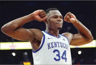  ?? JAMES CRISP / AP ?? Kentucky’s Oscar Tshiebwe (34) celebrates late in the second half against Auburn in Lexington, Ky. on Feb. 25. Tshiebwe was named to the AP All-SEC team.