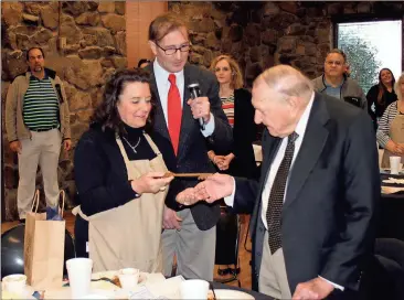  ?? Doug Walker / Rome News-Tribune ?? Rome City Commission­er Evie McNiece (from left) and Mayor Jamie Doss present a key to the city to U.S. District Court Judge Harold L. Murphy on Friday at the Community Criminal
Justice Foundation luncheon. Murphy has presided over the federal bench in...