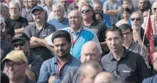  ?? CHRIS YOUNG/THE CANADIAN PRESS ?? Workers at a Bombardier plant in Toronto listen to Unifor national president Jerry Dias speak Wednesday amid mounting calls for Boeing to drop a trade complaint against Bombardier. Bombardier rejected claims that it is not co-operating with the probe.