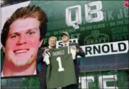  ?? DAVID J. PHILLIP — THE ASSOCIATED PRESS ?? USC’s Sam Darnold, right, poses for photos with Commission­er Roger Goodell after he was selected with the No. 3 overall pick by the New York Jets during the first round of the NFL Draft, Thursday Arlington, Texas.