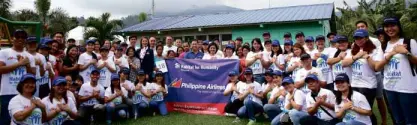  ??  ?? The PAL delegation, Habitat for Humanity officers and staff and residents of Humanity Ville pose for posterity before the event.