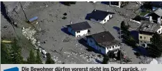  ?? AFP ?? Die Bewohner dürfen vorerst nicht ins Dorf zurück. Sehen Sie im Video auf 20min.ch die Aufräumarb­eiten.