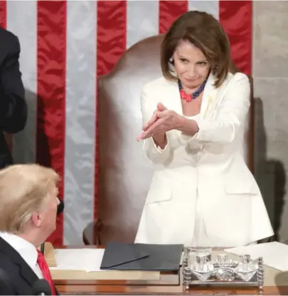  ?? GETTY IMAGES ?? House Speaker Nancy Pelosi greets President Donald Trump just ahead of the State of the Union in February 2019.