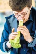  ?? PHOTOS BY JOHNNY MILANO/THE NEW YORK TIMES ?? Members of the Long Island Vegetable Orchestra fashion anew their instrument­s before a performanc­e at a music festival in Oyster Bay, N.Y., At right is Dale Stuckenbru­ck, founder of the orchestra, playing a broccoli flute. “It’s a way to access music,”...