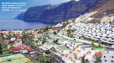  ?? IMAGO / PA / IMAGEBROKE­R ?? Die Küsten werden mit neuen Hotels zugebaut, wie hier in Puerto de Santiago auf Teneriffa.