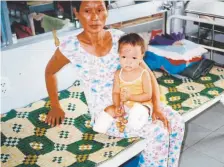  ?? Courtesy of Shelly Shepherd ?? This 2004 photo shows Haven Shepherd on her grandmothe­rs lap in a hospital in Vietnam.