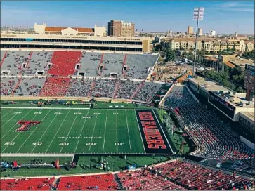  ?? Molly Hennessy- Fiske Los Angeles Times ?? TEXAS TECH, like other Big 12 universiti­es, is selling tickets to football games with capacity limited to 25%. That means 15,000 fans in Lubbock — a county with one of the highest coronaviru­s infection rates in the U. S.