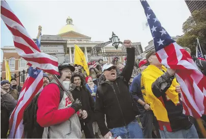  ?? STAFF PHOTOS, ABOVE, BY NICOLAUS CZARNECKI; HERALD PHOTO, TOP RIGHT, BY MARK LORENZ ?? FIST AND SHOUT: Rallygoers gather in front of the State House during yesterday’s protest, which resulted in three arrests. At top, a man is led away by police during the rally — which followed a sparsely attended protest in August. Organizers say...