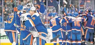  ?? Getty Images ?? WELL-OILED MACHINE: The Islanders celebrate Noah Dobson’s goal that gave them a 3-2 victory over the Oilers in overtime at UBS Arena on Saturday.