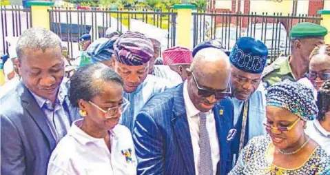  ?? ?? Permanent Secretary, Lagos State Primary Healthcare Board, Dr. Ibrahim Mustapha ( left); Permanent Secretary, Office of Secretary to the State Government/ Cabinet Office, Tolani Oshodi; Vice Chairman, Iba Local Council Developmen­t Area, Ayodele Thomas; Seyi Oyefeso of First Bank of Nigeria; Baale of Ijeododo land, High Chief Jelili Ododo, observe as Secretary to the State Government, Folasade Jaji, cuts the ribbon to commission primary healthcare centre sponsored by Firstbank in Ijeododo Community, in Lagos… on Wednesday.