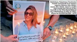  ?? ?? Bethlehem, Palestinia­n Territorie­s : Family and friends of al-jazeera reporter Shireen Abu Akleh, Anton Abu Akleh, attend a candle vigil outside the Church of the Nativity in the West Bank Biblical city of Bethlehem on May 16, 2022. (Photo by HAZEM BADER / AFP)