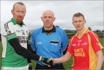  ??  ?? Rival captains Brendan Doyle (St. James’) and Barry Hearn (Horeswood) with referee Kevin Carty.