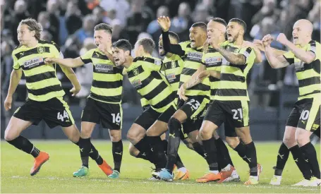  ??  ?? Huddersfie­ld celebrate their dramatic penalty shoot-out success at Sheffield Wednesday last night.