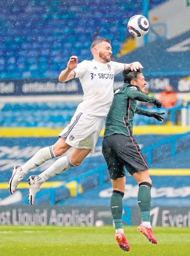  ??  ?? Leeds United defender Stuart Dallas easily wins an aerial battle