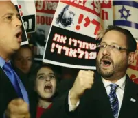  ?? (Courtesy) ?? DOV LIPMAN, then an MK, with Labor MK Hilik Bar at a rally for Jonathan Pollard last year opposite the hotel of US Secretary of State John Kerry.