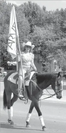  ?? MARK HUMPHREY ENTERPRISE-LEADER ?? Melody Pflaumer rides in the 2012 Lincoln Rodeo parade. Pflaumer was selected as the 2013 queen during last year’s pageant hosted by the Lincoln Riding Club and will preside over the 2013 Lincoln Rodeo, June 6-9.