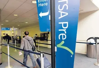  ?? TAIMY ALVAREZ/STAFF PHOTOGRAPH­ER ?? In December, 97 percent of TSA PreCheck passengers were each screened in under 5 minutes, according to the TSA.