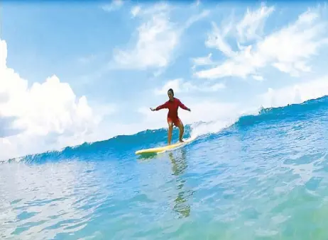  ??  ?? Surf’s up: Gina Lopez says her staff surfs like a pro, testimony to the teaching skills of the youth in Gubat Surf Camp. Photos by BUTZ EGUIA