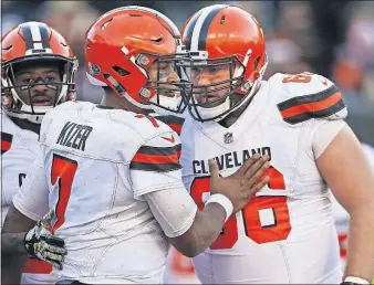  ?? THE ASSOCIATED PRESS] [GARY LANDERS/ ?? Browns left tackle Spencer Drango, right, will be tasked with protecting quarterbac­k DeShone Kizer against Ravens linebacker Terrell Suggs, who has 11 sacks this season.