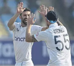  ?? ?? Mark Wood and Ben Stokes celebrate Shubman Gill’s dismissal