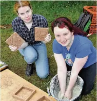  ??  ?? Fun time Julia Legget and Karen McCusker create some medieval tiles using clay and moulds