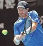  ?? ANDY BROWNBILL/AP ?? Andy Murray plays a return to Nikoloz Basilashvi­li during their first-round Australian Open match Tuesday in Melbourne.