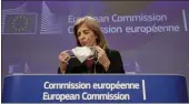  ?? OLIVIER HOSLET — POOL PHOTO ?? European Commission­er in charge of Health Stella Kyriakides removes her face mask during an online press conference on AstraZenec­a at the European Commission headquarte­rs in Brussels on Wednesday.