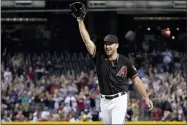  ?? MATT YORK - THE ASSOCIATED PRESS ?? Arizona Diamondbac­ks starting pitcher Tyler Gilbert celebrates after his no-hitter against the San Diego Padres, Saturday, Aug. 14, 2021, in Phoenix. It was Gilbert’s first career start. The Diamondbac­ks won 7-0.