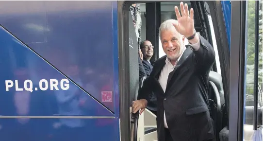  ?? JACQUES BOISSINOT/THE CANADIAN PRESS ?? After a campaign stop in Chicoutimi on Sunday, Quebec Liberal Leader Philippe Couillard headed to his home riding of Roberval, on Lac St-Jean.