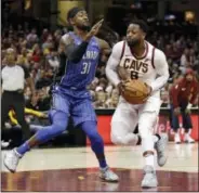  ?? TONY DEJAK — THE ASSOCIATED PRESS ?? Cleveland Cavaliers’ Dwyane Wade, right, drives past Orlando Magic’s Terrence Ross (31) in the first half of an NBA basketball game, Saturday in Cleveland.