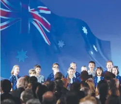  ?? NATIONAL PRIDE: A school choir sings the national anthem. ??