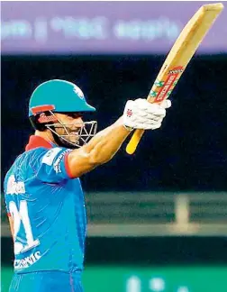  ?? —BCCI/IPL ?? Marcus Stoinis of Delhi Capitals acknowledg­es cheers after scoring a half-century against Kings XI Punjab in their IPL match in Dubai on Sunday.