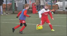  ?? 01_A03footy03 ?? The seniors tussle on the astroturf.