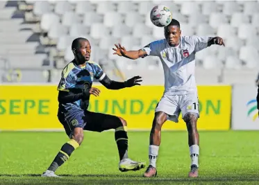  ?? BackpagePi­x ?? SPHIWE Mahlangu of TS Galaxy attempts to control possession as Thamsanqa Mkhize of Cape Town City looks on during their DStv Premiershi­p encounter at the Cape Town Stadium yesterday. |