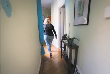  ?? Sarahbeth Maney / Special to The Chronicle ?? Empty nester Leigh Anne Varney walks through her home in San Francisco’s Outer Richmond District.