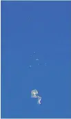  ?? TRAVIS HUFFSTETLE­R PHOTOGRAPH­Y VIA AP ?? The remnants of a balloon float over the Atlantic Ocean off the coast of the Carolinas Saturday.