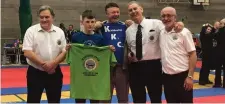  ??  ?? Overall tournament athlete Jake Riddle from KKC Cabragh, with his coach Niko Duffy being presented with his Clayton T-shirt and money prize