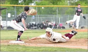  ?? Bud Sullins/Special to Siloam Sunday ?? Siloam Springs senior Dawson Armstrong dives back to first base as Russellvil­le first baseman Joel Barker fields the pickoff attempt from Cyclones starting pitcher Peyton Golden.