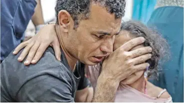  ?? ?? Injured Palestinia­ns, including children are brought to Al-aqsa Martyrs Hospital after an Israeli attack on Al-nuseirat refugee camp in Deir al-balah, Gaza