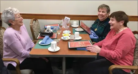  ?? PHOTO BY HARRY BEAM ?? Ann’s Choice resident Ellen Matter, in pink shirt, enjoys dining with friends at the Fireside Restaurant on campus.