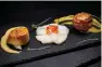  ??  ?? Deep sea scallops seared in Parma ham crust with roasted apple