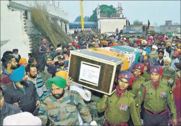  ?? SAMEER SEHGAL/HT ?? Army personnel carrying the coffin of Lance Naik Gurmail Singh in his village, Alkare, on Sunday.