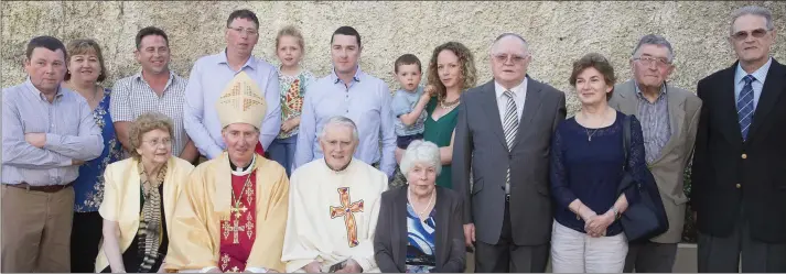  ??  ?? Fr Nolan with Bishop Brennan and members of his extended family at the jubilee celebratio­ns in Adamstown.