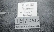  ??  ?? A sign stands at the entrance to the Justice for Our Stolen Children camp just after the final teepee was taken down. A few select protesters tore down the structure.