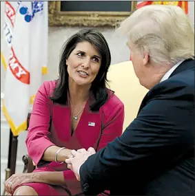  ?? AP/EVAN VUCCI ?? U.N. Ambassador Nikki Haley joins President Donald Trump in the Oval Office on Tuesday to announce her resignatio­n. Trump said he hopes to name her successor in the next two to three weeks.