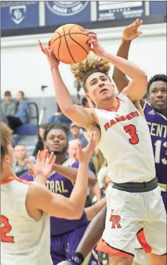  ?? Scott Herpst ?? Jordan Kennerly pulls down a rebound for the Ramblers in their Chick-fil-A Tournament opener against Chattanoog­a Central last Tuesday. LaFayette went 3-0 and won the title after a 43-42 thriller over Heritage in the finals.