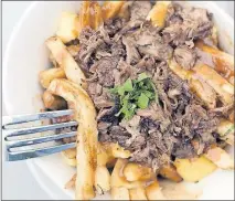  ?? [TIM JOHNSON/ALIVE] ?? The pork-cheek poutine A: Q: A: